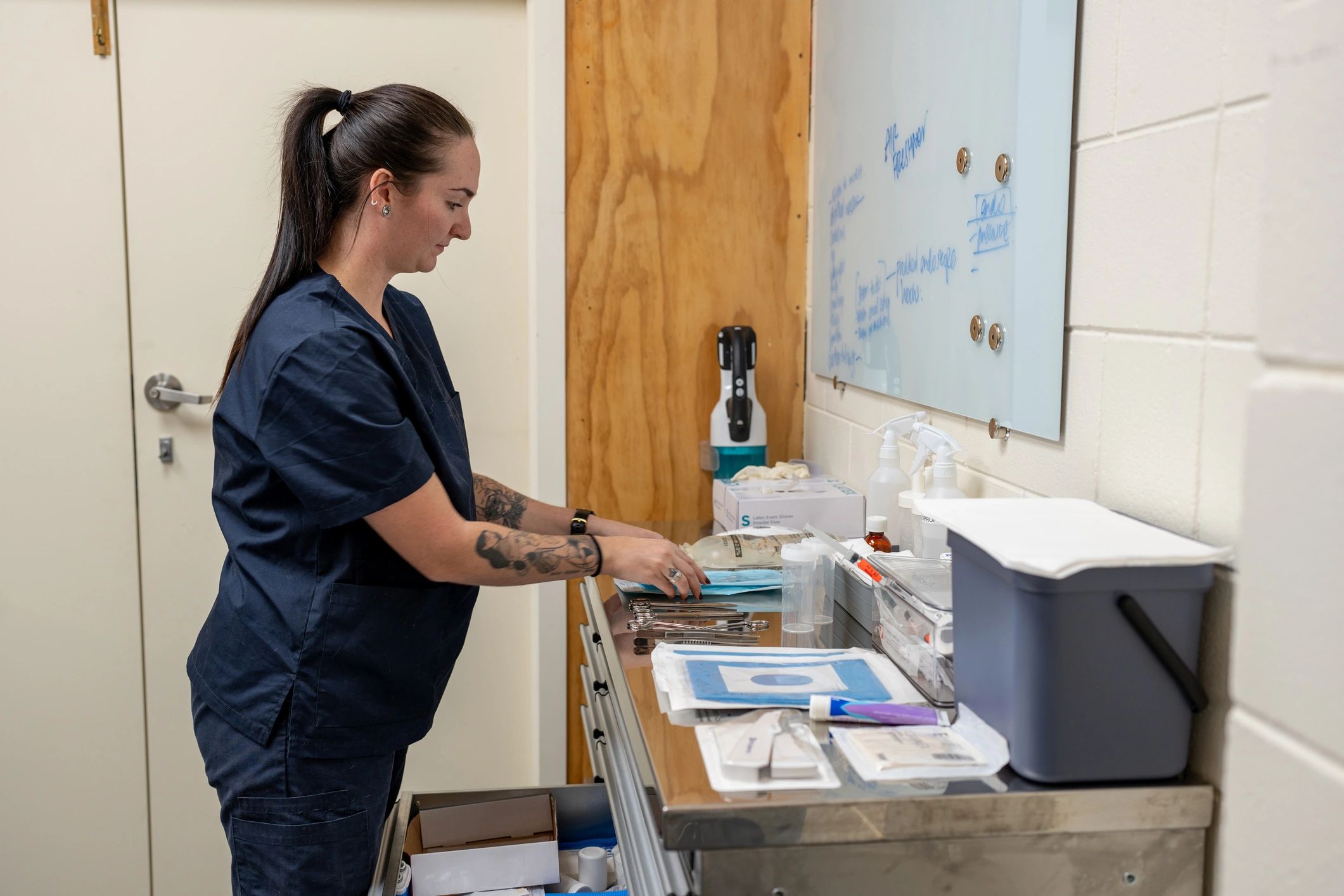 Volunteer preparing supplies in a clinic setting